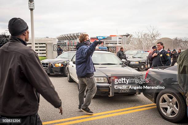 An unidentified young male confronts a police officer on E.9th St. On December 29, 2015 in Cleveland, Ohio. Protestors took to the street the day...