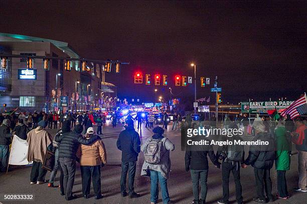 Demonstrators block traffic at the corner of Ontario Street and Huron Road near Quicken Loans Arena on December 29, 2015 in Cleveland, Ohio....