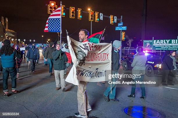 Demonstrators block traffic at the corner of Ontario Street and Huron Road near Quicken Loans Arena on December 29, 2015 in Cleveland, Ohio....