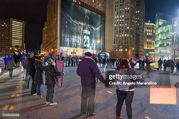 Demonstrators block traffic at the corner of Ontario Street and Huron Road near Quicken Loans Arena on December 29, 2015 in Cleveland, Ohio....