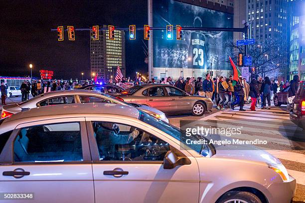 Demonstrators block traffic at the corner of Ontario Street and Huron Road near Quicken Loans Arena on December 29, 2015 in Cleveland, Ohio....