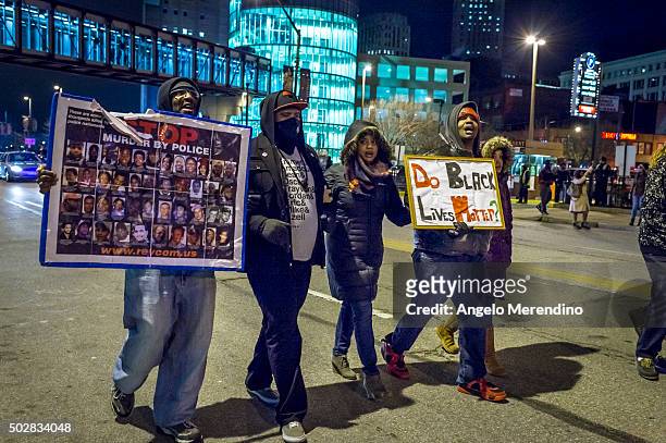 Protestores march on Huron Road on December 29, 2015 in Cleveland, Ohio. Demonstrators took to the street the day after a grand jury declined to...