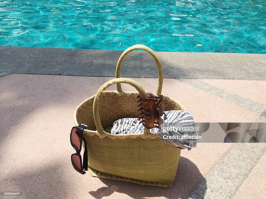 Summer bag by swimming pool