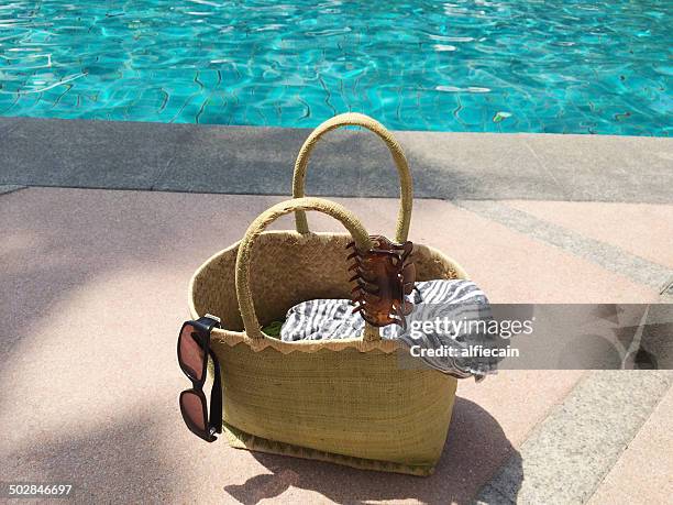 summer bag by swimming pool - tote bag stock pictures, royalty-free photos & images