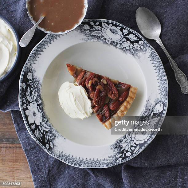 pecan pie with toffee and whipped cream - pecan pie stock pictures, royalty-free photos & images