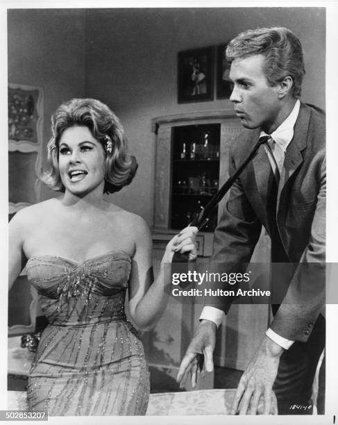 Sue Ane Langdon grabs Harve Presnell necktie in the movie "When the Boys Meet the Girls " circa 1965.