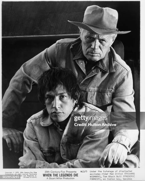 Richard Widmark poses with Frederic Forrest for the 20th Century Fox movie "When the Legends Die" circa 1971.