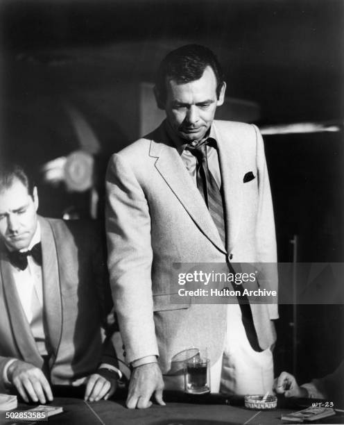 David Janssen puts down his cards in a scene for the United Artist movie "Where It's At" circa 1968.
