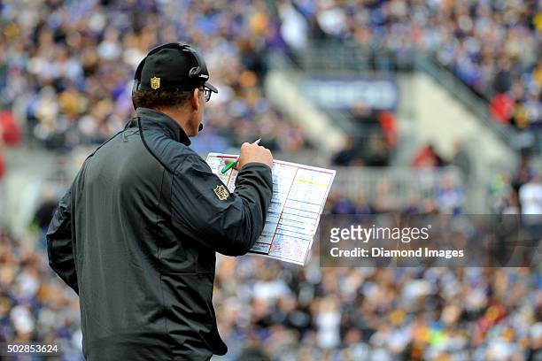 Offensive coordinator Marc Trestman of the Baltimore Ravens calls plays from the sideline during a game against the Pittsburgh Steelers on December...