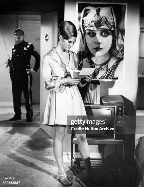 Rosemary Forsyth looks threw papers in a scene for the United Artist movie "Where It's At" circa 1968.