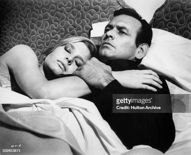 David Janssen lays in bed with Rosemary Forsyth in a scene for the United Artist movie "Where It's At" circa 1968.