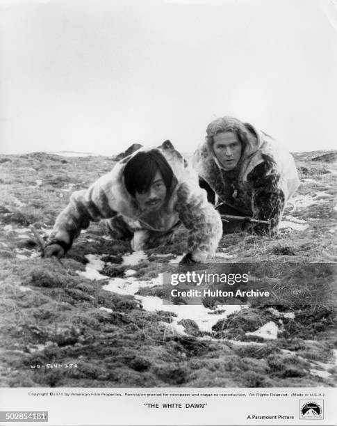 Joanasie Salamonie and Timothy Bottoms hunt in a scene from the Paramount Pictures movie "The White Dawn" circa 1974.