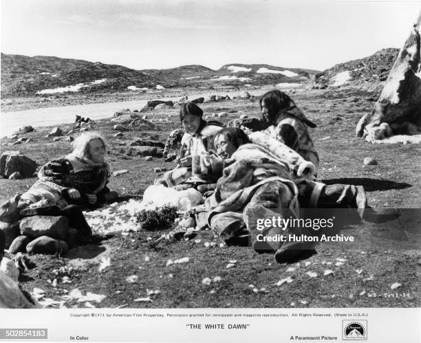 Timothy Bottoms encounters Eskimos Pilitak, Meetook Mallee and Seemee Nookiguak in a scene from the Paramount Pictures movie "The White Dawn" circa...