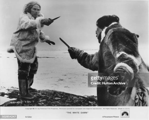 Timothy Bottoms is confronted by Joanasie Salamonie in a scene from the Paramount Pictures movie "The White Dawn" circa 1974.