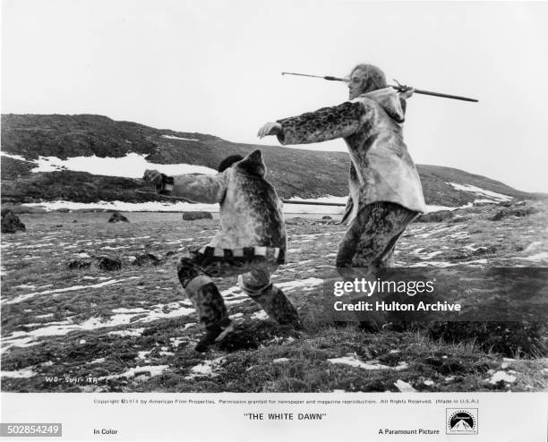 Joanasie Salamonie and Timothy Bottoms hunt in a scene from the Paramount Pictures movie "The White Dawn" circa 1974.