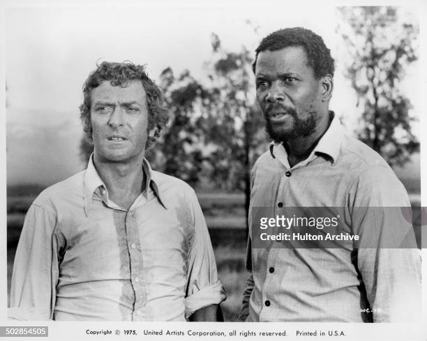 Michael Caine and Sidney Poitier looks on in a scene from the movie United Artist movie "The Wilby Conspiracy" circa 1975.