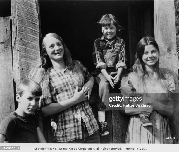 Matthew Burrill, Julie Gholson, Helen Harmon, Jan Smithers pose for the United Artist movie "Where the Lilies Bloom" circa 1974.