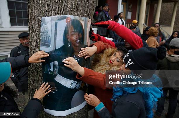 Family and friends post a photo of Bettie Jones, who along Quintonio LeGrier was shot and killed by police, during a vigil outside the West Garfield...