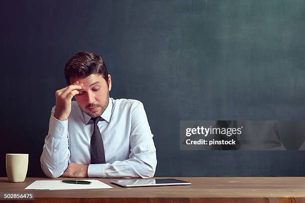 ein deprimierter geschäftsmann - teacher studio portrait stock-fotos und bilder