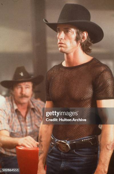 Actor Scott Glenn stands in a scene during the Paramount Pictures movie 'Urban Cowboy" circa 1980.