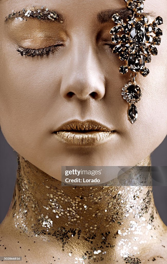 Close up beautiful woman posing with luxury jewellery