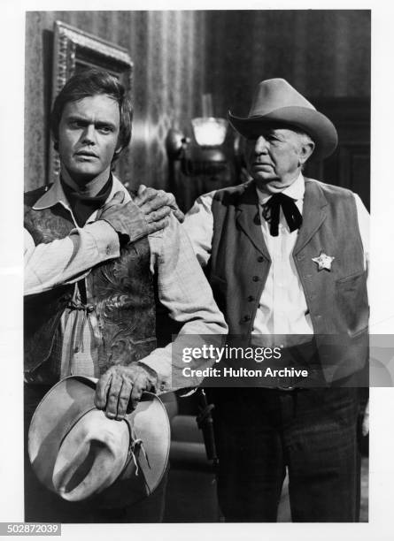 Roger Davis and Walter Brennan in a scene for the television movie of the week "The Young Country" circa 1970.