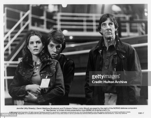 Ally Sheedy, Matthew Broderick and John Wood watch the NORAD defense computers in a scene for the MGM/UA movie "WarGames" circa 1983.