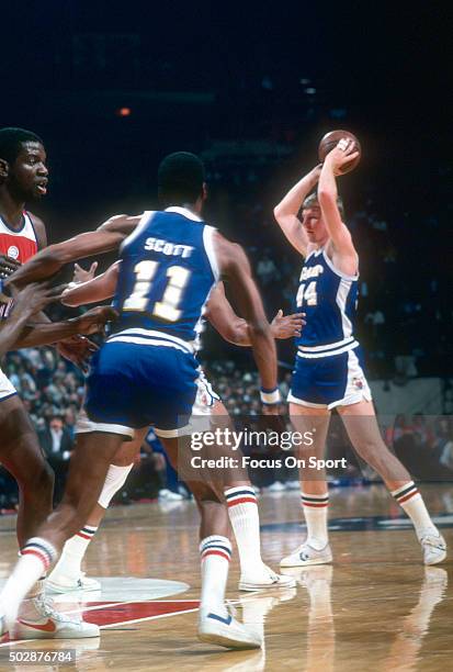 Dan Issel of the Denver Nuggets looks to pass the ball against the Washington Bullets during an NBA basketball game circa 1979 at the Capital Centre...