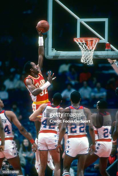 Dan Roundfield of the Atlanta Hawks goes up to slam dunk against the Washington Bullets during an NBA basketball game circa 1982 at the Capital...