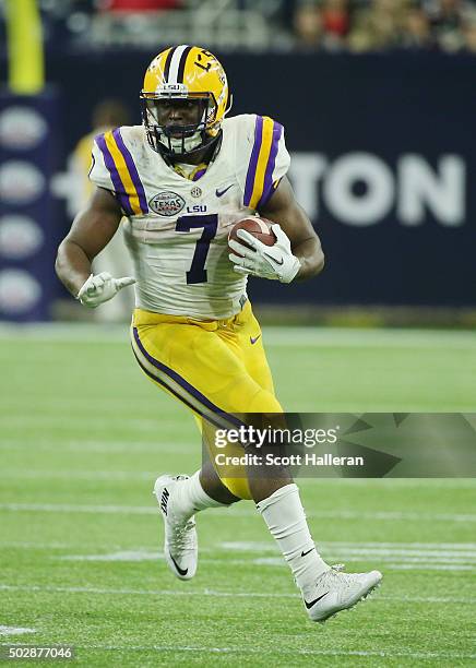 Leonard Fournette of the LSU Tigers runs with the ball during the second half of their game against the Texas Tech Red Raiders during the AdvoCare...