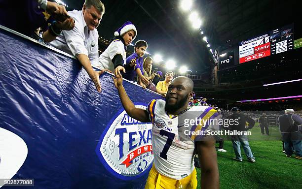 Leonard Fournette of the LSU Tigers greets fans after the Tigers defeated the Texas Tech Red Raiders 56-27 during the AdvoCare V100 Texas Bowl at NRG...