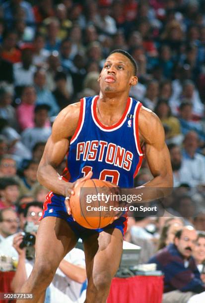 Dennis Rodman of the Detroit Pistons looks to shoot against the Chicago Bulls during an NBA basketball game circa 1991 at Chicago Stadium in Chicago,...