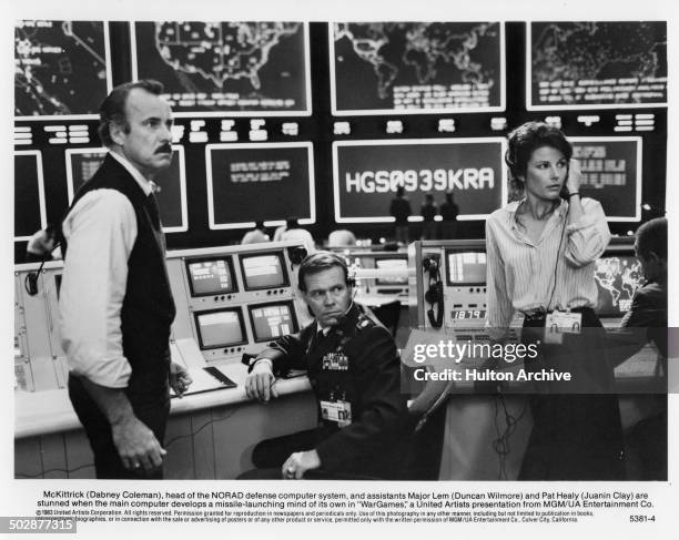 Dabney Coleman, Duncan Wilmore and Juanin Clay watch the NORAD defense computers in a scene for the MGM/UA movie "WarGames" circa 1983.