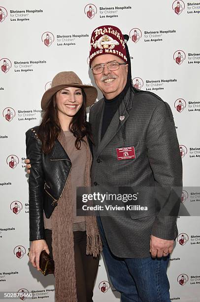 Actress Heather McComb and Shriners Hospitals forChildren - Los Angeles board chairman David R. Doan attend Celebrities Decorate The Shriners Rose...