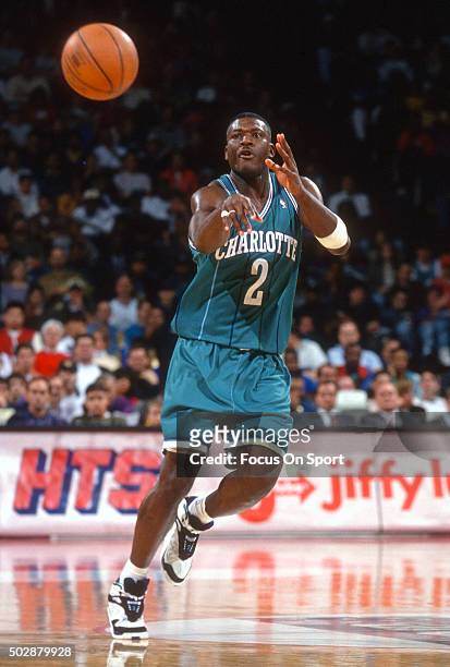 Larry Johnson of the Charlotte Hornets passes the ball against the Washington Bullets during an NBA basketball game circa 1993 at the US Airways...