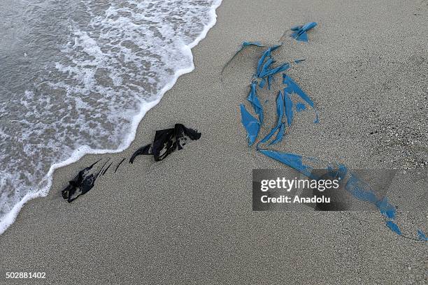 Belongings of refugees who took boats from Turkey to Lesbos Island wash up on a beach of Dikili district of Izmir, Turkey on December 30, 2015....