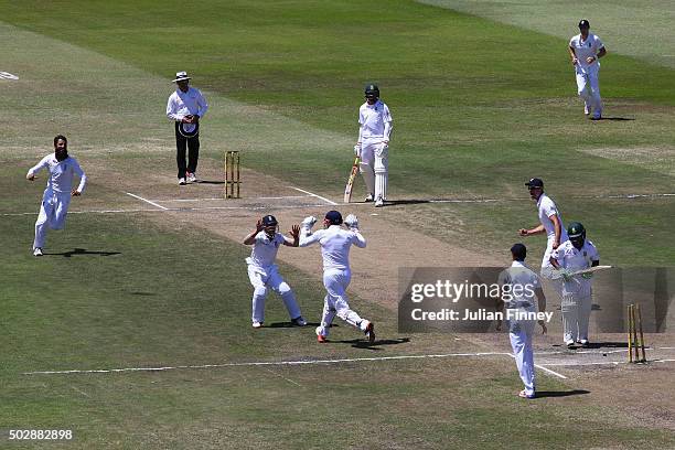Moeen Ali of England celebrates taking the wicket of Temba Bavuma of South Africa after Jonny Bairstow of England stumped him during day five of the...