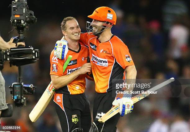 Michael Klinger and Shaun Marsh of the Scorchers celebrate after the winning runs were hit to win the Big Bash League match between the Melbourne...