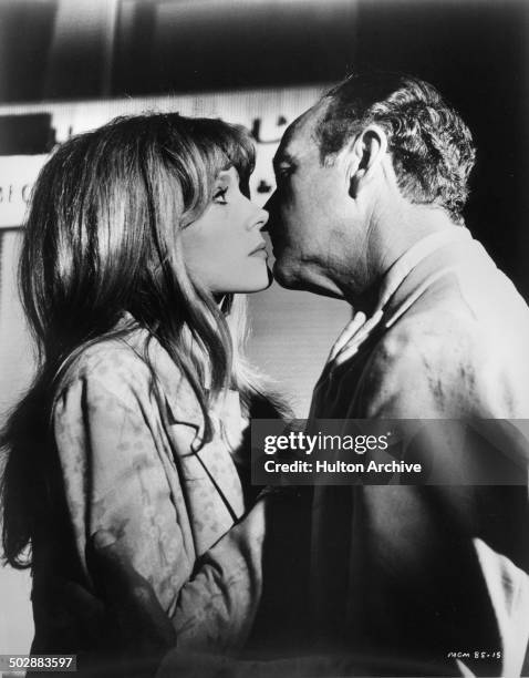 David Niven kisses Francoise Dorleac in a scene from the MGM movie "Where the Spies Are" circa 1965.