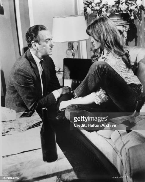 David Niven talks to Francoise Dorleac in a scene from the MGM movie "Where the Spies Are" circa 1965.