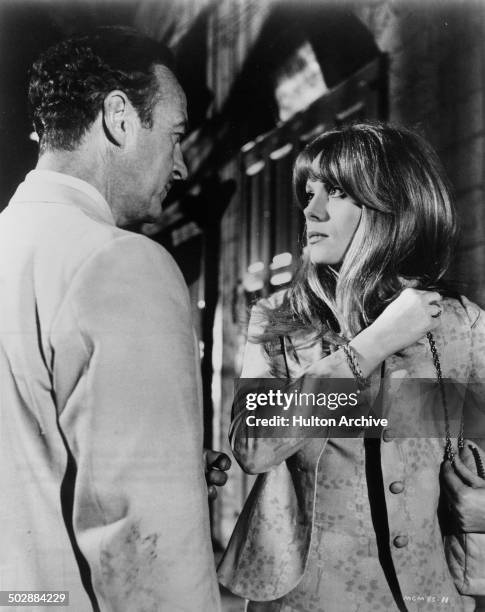 David Niven listens to Francoise Dorleac in a scene from the MGM movie "Where the Spies Are" circa 1965.