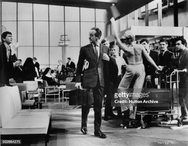 David Niven ignores Francoise Dorleac in a scene from the MGM movie "Where the Spies Are" circa 1965.