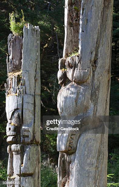 decaying haida mortuary poles - haida gwaii totem poles stock pictures, royalty-free photos & images
