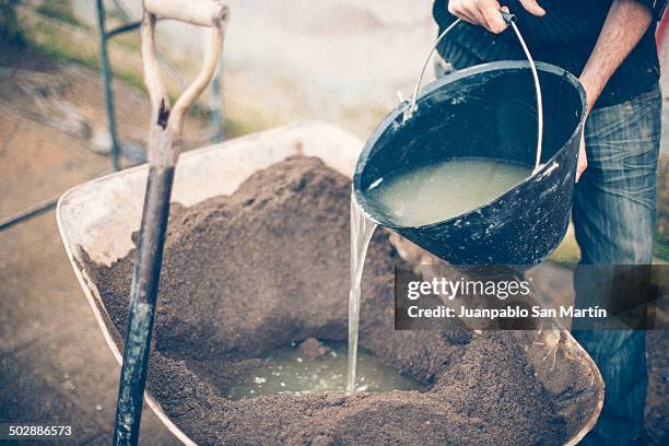 mix constrution - wheelbarrow stock pictures, royalty-free photos & images