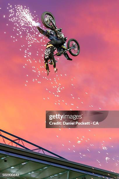 Freestyle Moto X riders perform during the Big Bash League match between the Melbourne Renegades and the Perth Scorchers at Etihad Stadium on...