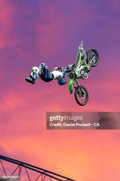 Freestyle Moto X riders perform during the Big Bash League match between the Melbourne Renegades and the Perth Scorchers at Etihad Stadium on...