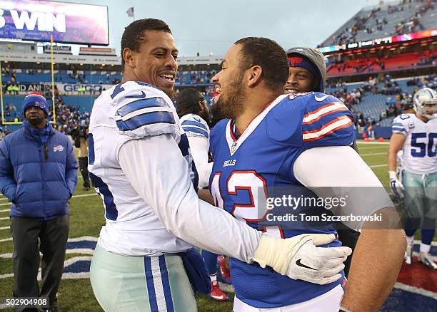 Greg Hardy of the Dallas Cowboys greets Jerome Felton of the Buffalo Bills after their NFL game at Ralph Wilson Stadium on December 27, 2015 in...