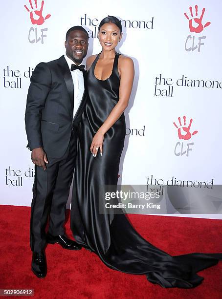 Actor/comic Kevin Hart and model Eniko Parrish attend the Rihanna And The Clara Lionel Foundation 2nd Annual Diamond Ball at The Barker Hanger on...