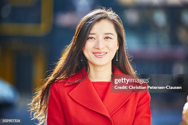 successful asian businesswoman with long hair smiling - cfo stock pictures, royalty-free photos & images