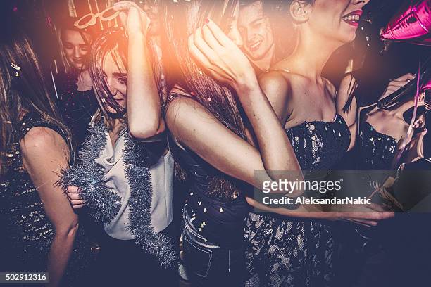 crowd on a dance floor - social action party stock pictures, royalty-free photos & images